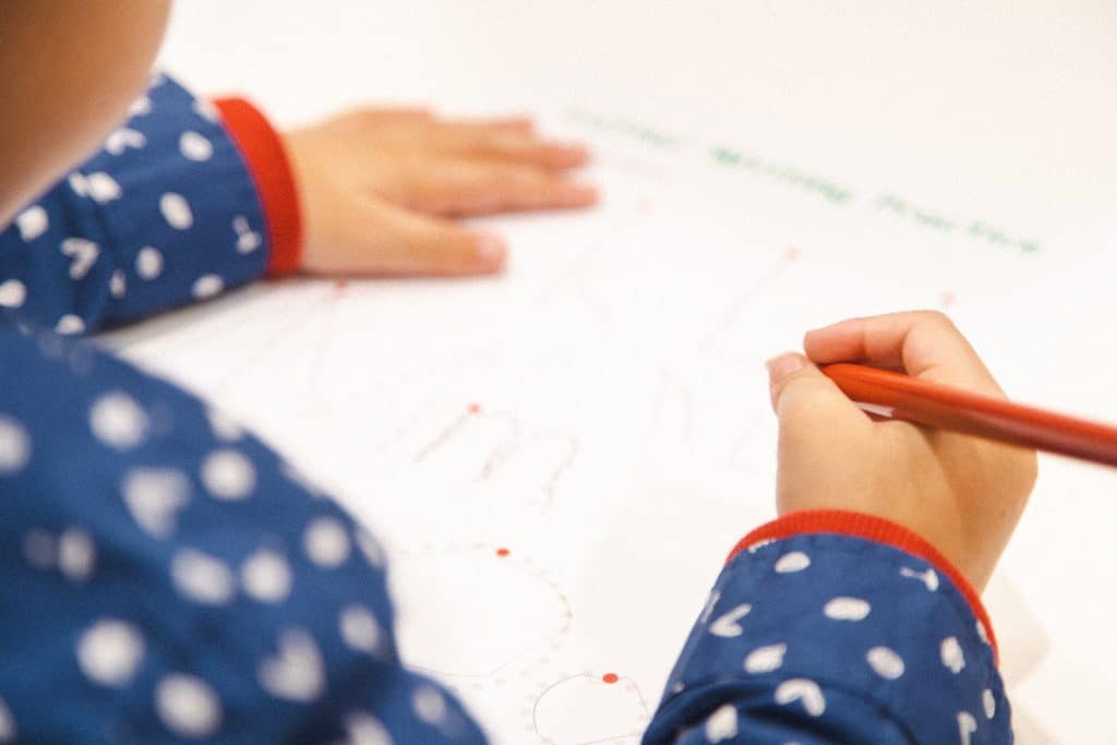 Transitioning To Kinder - young child practicing writing