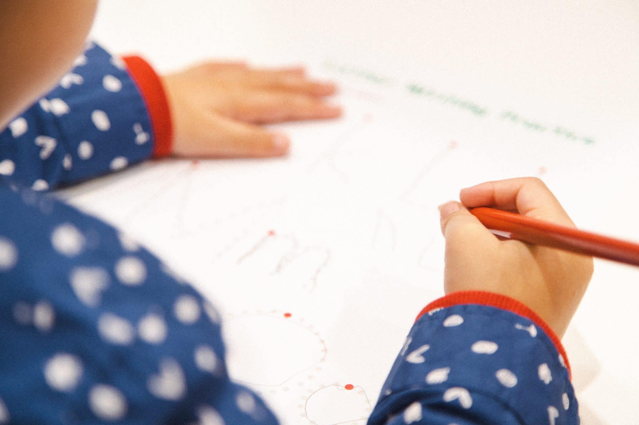 Transitioning To Kinder - young child practicing writing