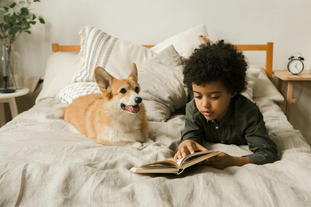 A child reading a book - reading books within the correct Reading Lexile range enhances the reading journey.