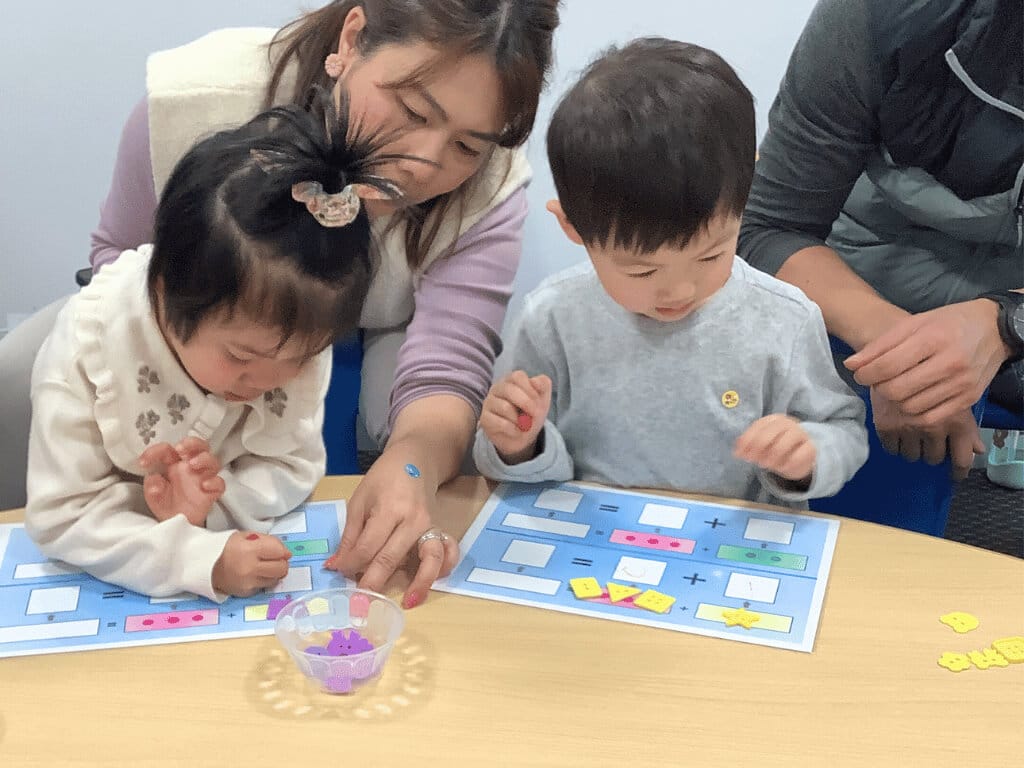 fine motor activities for preschoolers - a child playing a number game