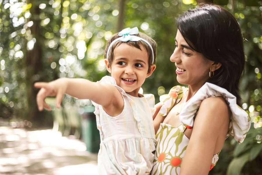 Nurture curiosity through parental engagement, here a mum and child are spending time outside.