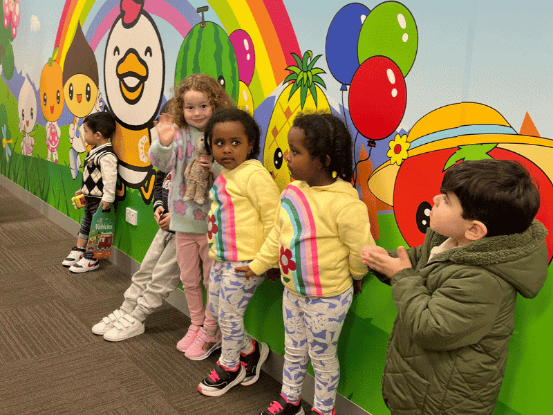 a group of kids standing in a line