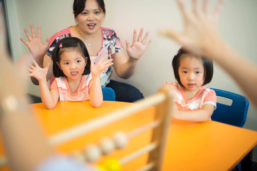Curious kids in a Shichida class, playing a numeracy game.
