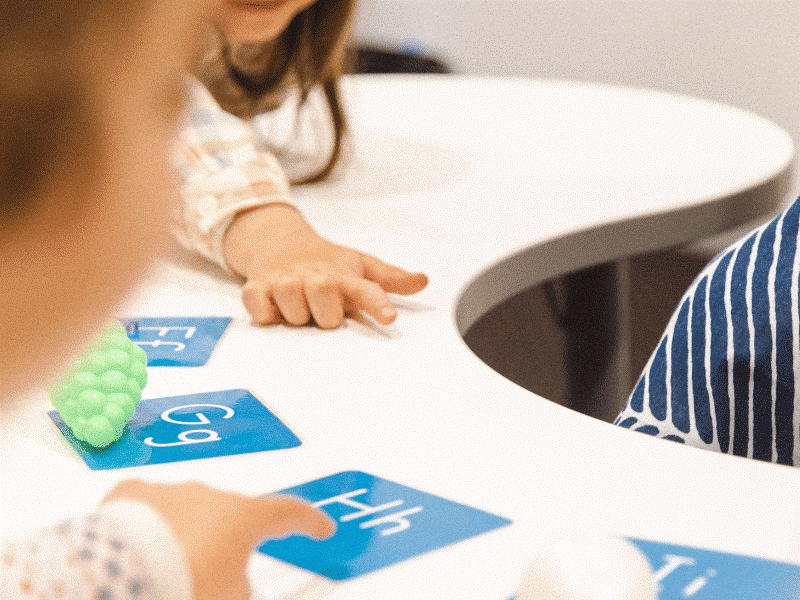preschoolers explore letter cards and objects to build strong alphabet and phonics foundations