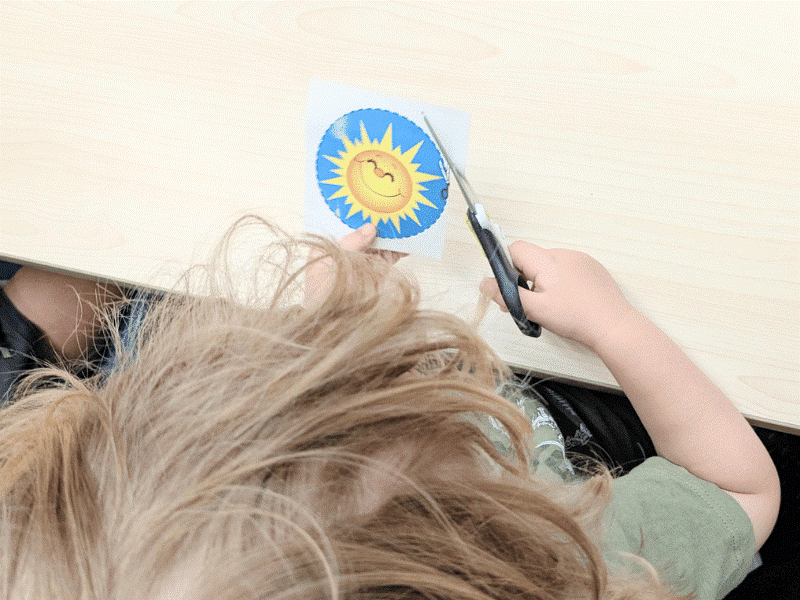 Cutting with scissors is a classic bilateral coordination exercise that strengthens fine motor skills and hand control - essential for school readiness and independence